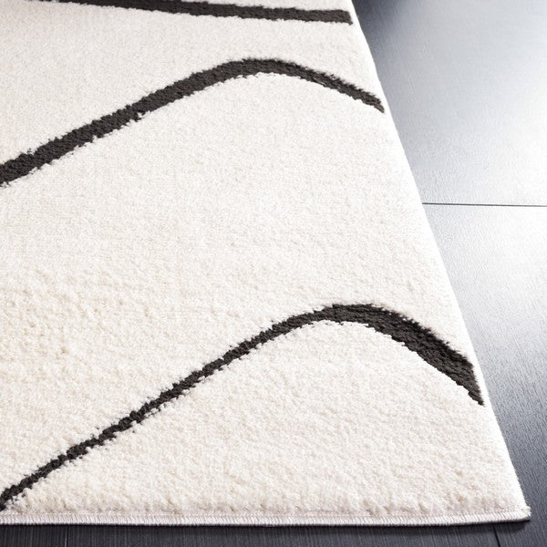 Ivory/Black Modern Power Loomed Rug - MEL120A by Safavieh